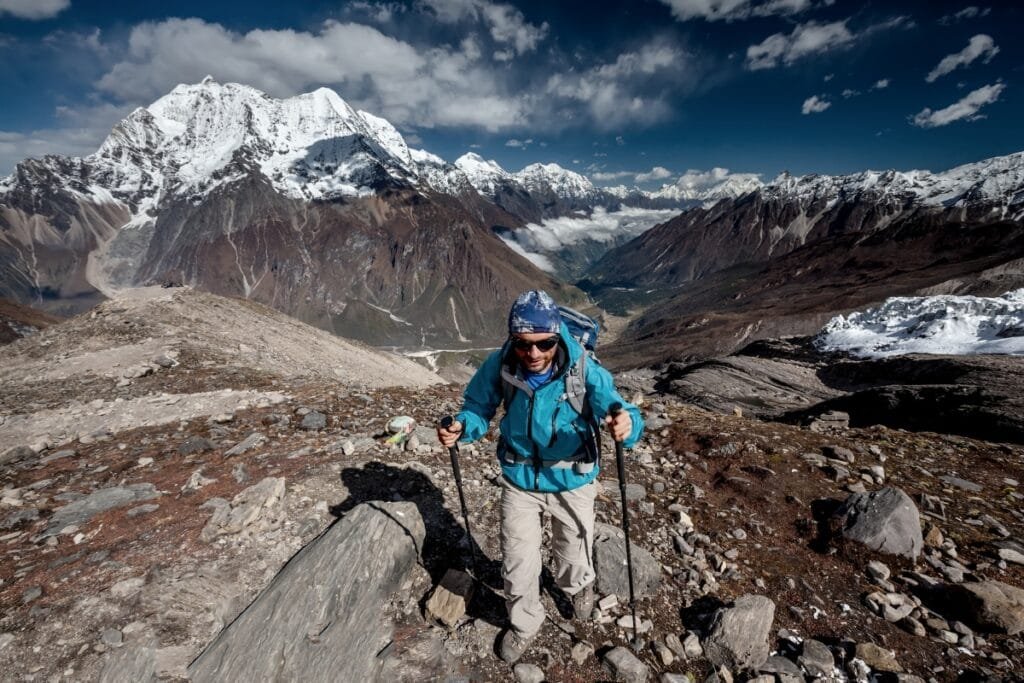 Hiker is climbing to Manaslu Base Camp