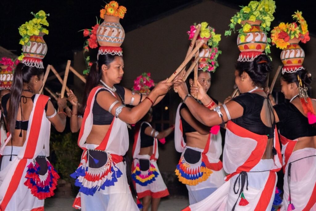 "Tharu women dancing in their cultural dance in Tharu costume"